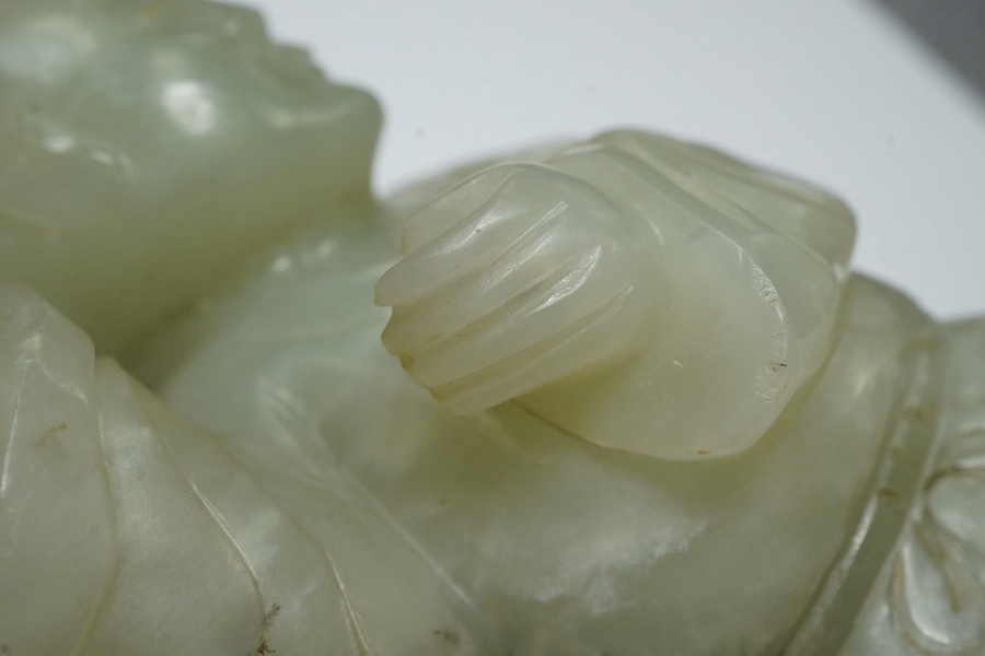 A Chinese pale celadon jade figure of a boy, 18th century